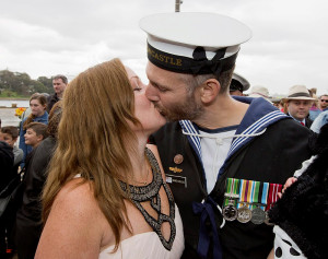 SHE SAID YES! Leading Seaman Warwick Douglas kisses his new fiancée after proposing to her on the wharf of Fleet Base East. Photo by Able Seaman Tom Gibson.