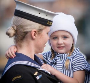 Leading Seaman Leticia Hosking holds her daughter before embarking in HMAS Newcastle for departure to the Middle East. Photo by Able Seaman Bonny Gassner.