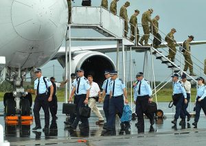 The first contingent of Australian Federal police arrive in Honiara.