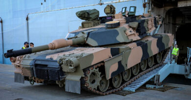 An Australian Army M1A2 Abrams main battle tank boards HMAS Adelaide during sea transportability trials at the Port of Townsville, Queensland. Story by Eamon McCaughan. Photo by Lieutenant Commander Anthony Martin