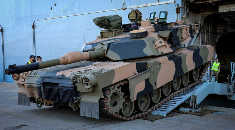 An Australian Army M1A2 Abrams main battle tank boards HMAS Adelaide during sea transportability trials at the Port of Townsville, Queensland. Story by Eamon McCaughan. Photo by Lieutenant Commander Anthony Martin