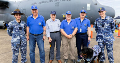 Cadet Katelyn Wichman, left, and Cadet Oscar Brown, right, stand either side of former Royal Australian Air Force C-130 Hercules loadmasters Bob Pearman, Herman ‘Dave’ Jones, Cole Coyne, Stue Hablethwaite and his service dog at the RAAF Richmond Airshow. Story by Flight Sergeant Mark Eaton.