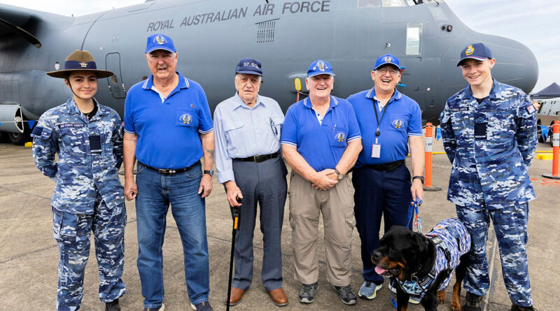 Cadet Katelyn Wichman, left, and Cadet Oscar Brown, right, stand either side of former Royal Australian Air Force C-130 Hercules loadmasters Bob Pearman, Herman ‘Dave’ Jones, Cole Coyne, Stue Hablethwaite and his service dog at the RAAF Richmond Airshow. Story by Flight Sergeant Mark Eaton.