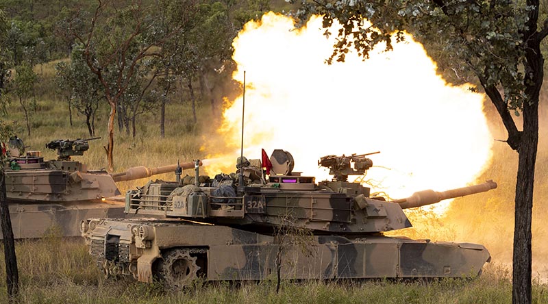 Two 2nd Cavalry Regiment M1A2 Abrams main battle tanks conduct a live-fire serial at Townsville Field Training Area, Queensland. Photo by Lance Corporal Caitlyn Davill.
