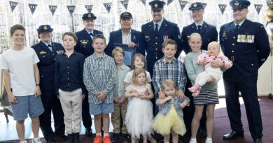 Phillip 'Monro' Preuss celebrates his century with his great-grandchildren and 1 Recruit Training Unit members, from left, Squadron Leader Shannon Monk, Wing Commander Jodie Mason, Sergeant Nick Harrison, Corporal Tahlia Stockley and Warrant Officer David Harding. Story and photos by Flying Officer Belinda Barker.