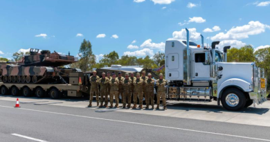 Australian Army and Royal Australian Air Force personnel with the new Kenworth prime mover truck at RAAF Base Amberley, Queensland. Story by Corporal Luke Bellman. Photo by Leading Aircraftwoman Nell Bradbury.