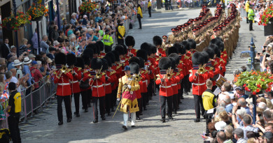 The Band of the Grenadier Guards lead an Armed Forces Day Parade through Guildford on Armed Forces Day 2015.