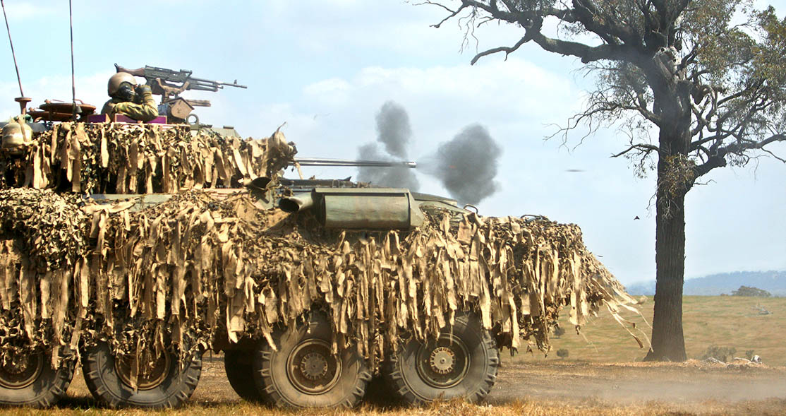 An Australian Light Armoured Vehicle fires its 25mm main gun