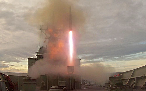 An Evolved Sea Sparrow Missile fires from HMAS Melbourne's MK-41 vertical launcher during training in the East Australian Exercise Area off the New South Wales coast.