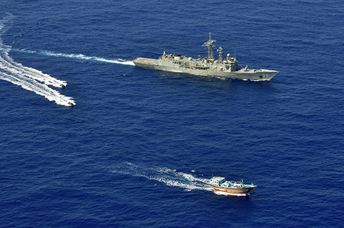 HMAS Newcastle's sea boats approach a dhow for a flag verification as part of operations involving narcotics interdiction off the east coast of Africa.