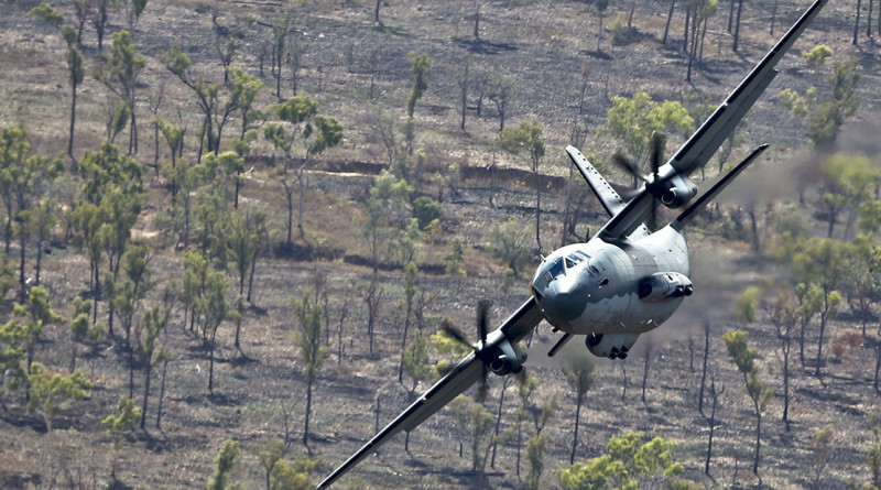 A No 35 Squadron C-27J Spartan flies at low level over Aussie bush.