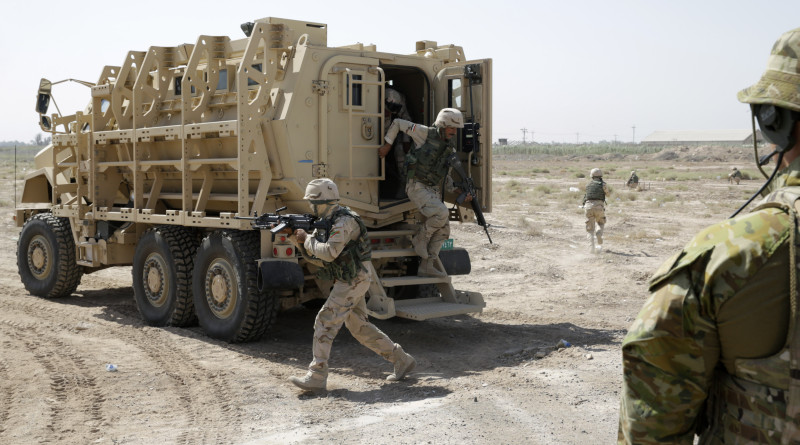 Australian Army trainer observes an Iraqi soldier dismount from their “Mine Resistant Ambush Protected (MRAP)” vehicle during a training exercise at the Taji Military Complex northwest of Baghdad: http://images.defence.gov.au/20150616adf8487947_032.jpg