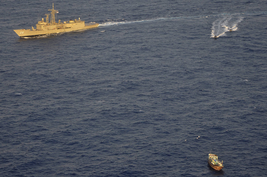 A boarding party from HMAS Newcastle approaches a dhow off the east coast of Africa.