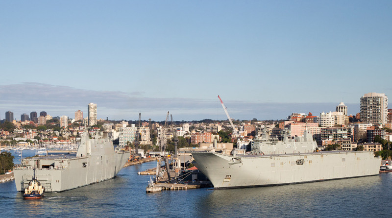 The largest ships ever built for the Royal Australian Navy, Landing Helicopter Dock NUSHIP Adelaide, left, and HMAS Canberra at Fleet Base East, Garden Island, Sydney.