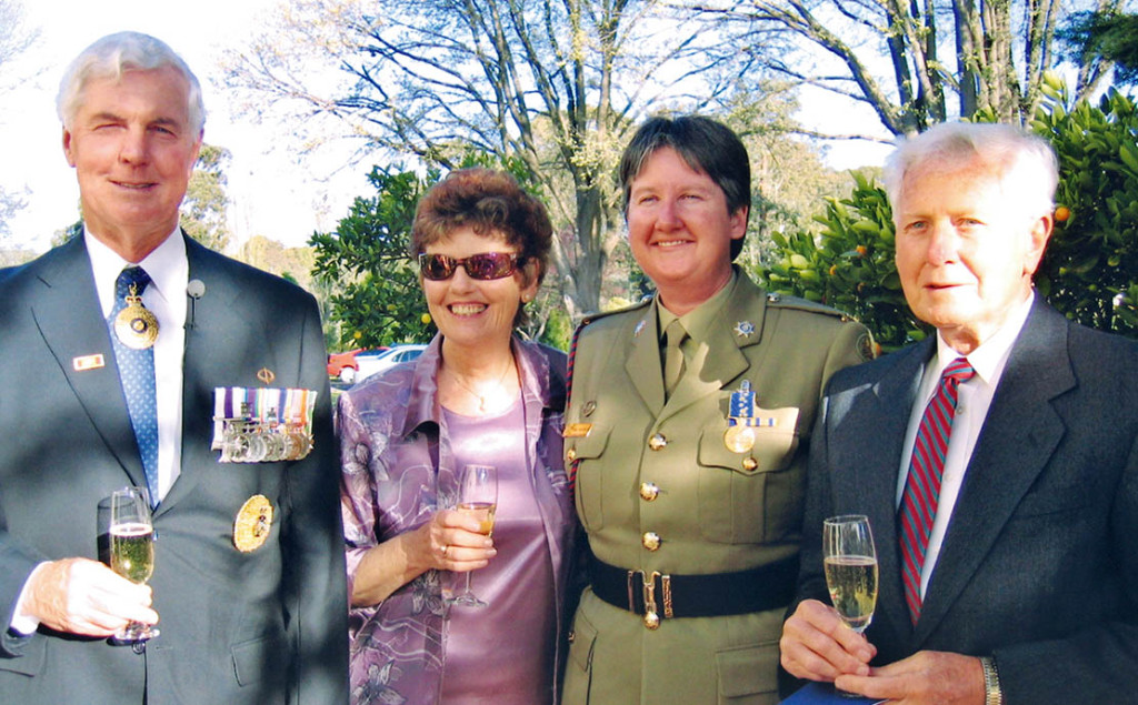 Sergeant Sandy McInerney with her proud parents and then Governor General Michael Jeffery.