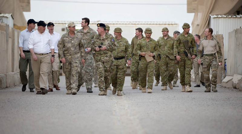 Governor-General of Australia, General Sir Peter Cosgrove (second from left), Commander Joint Task Force 633 Rear Admiral Trevor Jones (sixth from left), Corporal Ben Roberts-Smith VC (fifth from left), Corporal Daniel Keighran VC (seventh from right, rear without hat) and Corporal Mark Donaldson VC (far right), during their visit to the Taji Military Complex, Iraq. Photo by Corporal Matthew Bickerton