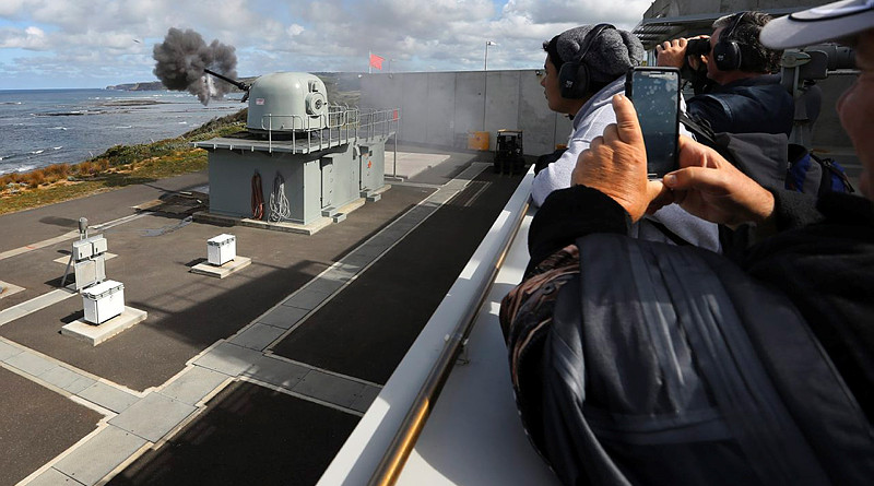 Members of the Royal Australian Engineers Regiment and Royal Australian Artillery Regiment witness a medium calibre Mk75 Mod 0 76mm gun firing from the Operations Room of West Head Gunnery Range, Flinders, Victoria. Photo by Leading Seaman Dove Smithett