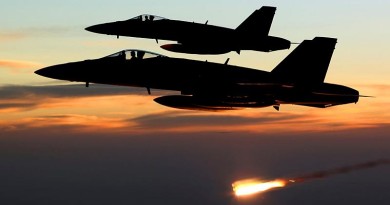 An Australian F/A-18A Hornet relelases a flare at sunset in the skies over Iraq. RAAF photo.