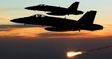 An Australian F/A-18A Hornet relelases a flare at sunset in the skies over Iraq. RAAF photo.