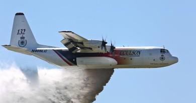 'Thor', a C-130 Hercules contracted to the NSW Government to assist in fighting bushfires dispenses water during a demonstration over the Rickaby's drop zone near RAAF Base Richmond. Photo by Corporal David Said