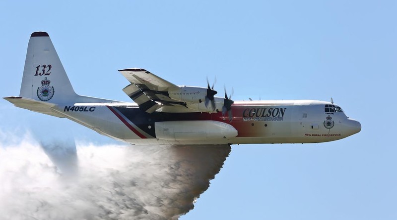 'Thor', a C-130 Hercules contracted to the NSW Government to assist in fighting bushfires dispenses water during a demonstration over the Rickaby's drop zone near RAAF Base Richmond. Photo by Corporal David Said
