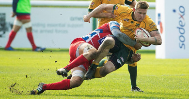 Australian Army Sergeant Scott Ashurst is tackled during the match against the French National Military rugby team at Aldershot. Photo by Corporal Janine Fabre