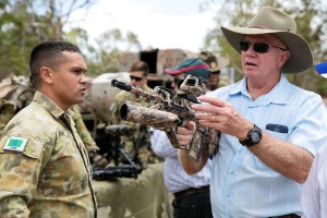 Corporal Kevin Ashby 1RAR explains the characteristics of the new EF88 to former 1RAR soldier Dave Piccinelli.