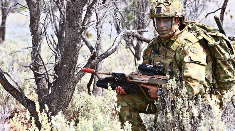A 7RAR soldier in full body armour,light-weight helmet and "soldier carriage ensemble (minus pack)". Photo by Brian Hartigan.