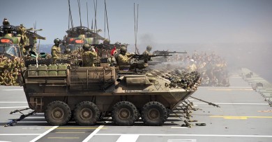 Australian Army Light Armoured Vehicles from 2nd Cavalry Regiment, conduct a live fire shoot from HMAS Canberra’s flight deck, as part of Exercise Sea Raider.