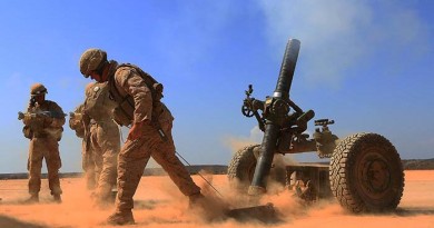 Marines with Alpha Battery, 1st Battalion 4th Marines, 13th Marine Expeditionary Unit fires a 120mm Rifled Tower Mortar. USMC photo by SSgt Matt Orr