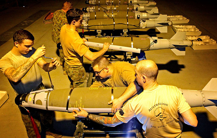 RAAF Aircraft Armament Technicians prepare GBU-54 and GBU-38 bombs for use by the Australian Air Task Group. Photo by Corporal Ben Dempster