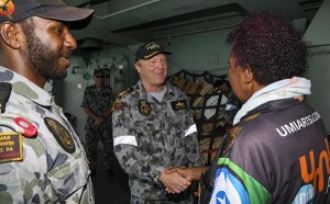 Seaman Edmond Tomsana introduces his mother to Commander Phillip Henry.