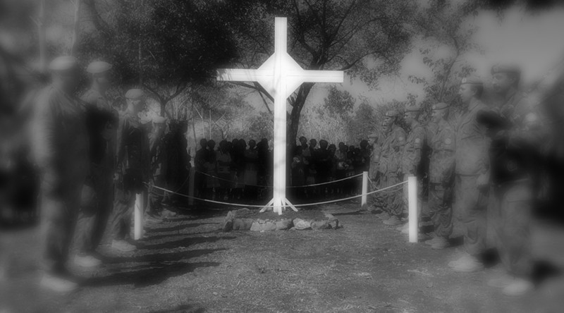 "OPERATION TANAGER" PIC BY CPL JASON WEEDING PIPERS AND SOLDIERS OF 6RAR PARADE BEFORE A REPLICA CROSS OF THE ONE USED IN THE 1969 VIETNAM SERVICE AS THEY AWAIT THE START OF THE LONG TAN DAY COMMEMORATIVE SERVICE HELD NEAR BALIBO, EAST TIMOR. THE PARADE CONFIGURATION RE-ENACTS THAT OF THE ORIGINAL.