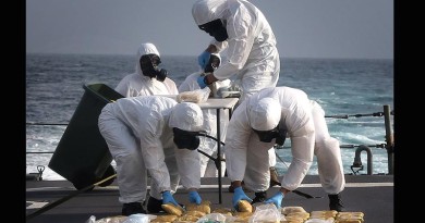 HMAS Melbourne personnel dispose of 65kg illegal narcotics (heroin) seized from a dhow in the northern Indian Ocean. Photo by Able Seaman Bonnie Gassner