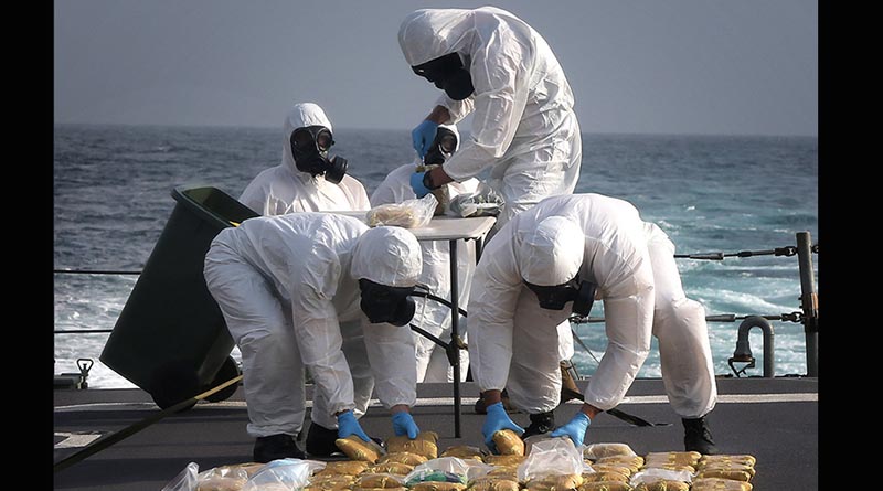 HMAS Melbourne personnel dispose of 65kg illegal narcotics (heroin) seized from a dhow in the northern Indian Ocean. Photo by Able Seaman Bonnie Gassner
