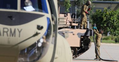 An Australian Army CH-47F Chinook helicopter from 5th Aviation Regiment refuels an M1A1 Abrams tank from 2nd Cavalry Regiment during Exercise Eagle Walk, a trial to prove aviation can safely refuel ground based vehicles. Photo by Major Al Green