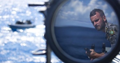 Sub Lieutenant Jackson Miller observes boat evolutions onboard HMAS Wollongong as she saisl across the Arafura Sea. Photo by Able Seaman Kayla Hayes.