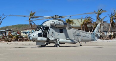 An SH-2G(NZ) Seasprite helicopters assisting with cyclone-recovery operations in Fiji.