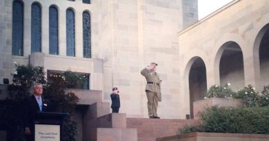 Drew Douglas salutes during The Last Post Ceremony at the Australian War Memorial