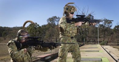 Corporal Paul Hayes (left), 6RAR, and Warrant Officer Class Two Nick Crosbie, 7RAR, trial the new Reaper weapon carriage system. Photo by Sergeant Janine Fabre.