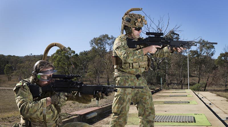 Corporal Paul Hayes (left), 6RAR, and Warrant Officer Class Two Nick Crosbie, 7RAR, trial the new Reaper weapon carriage system. Photo by Sergeant Janine Fabre.