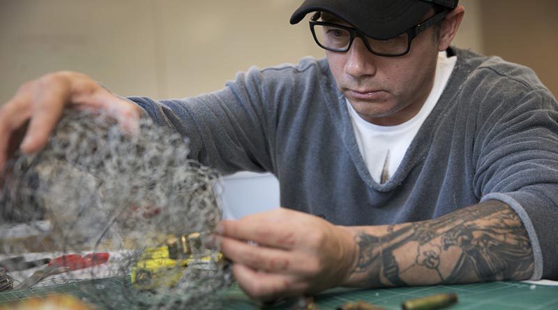 Australian Army soldier Lance Corporal Ty Tranter works on his wire-mesh sculpture during the ADF Arts for Recovery, Resilience, Teamwork and Skills program at the University of Canberra on 18 May 2016.