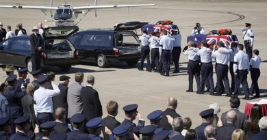 Onlookers pay respects as two caskets are carried to waiting hearses during the repatriation of two Australian servicemen missing from the Vietnam War. Flying Officer Michael Herbert and Pilot Officer Robert Carver failed to return from a routine bombing mission on 3 November 1970. They were recovered in thick jungle in an rugged, remote and sparsely populated area of Quang Nam Province, Vietnam, near the Laotian border, and repatriated to Australia in 2009. Photo by Leading Aircraftwoman Amanda Campbell.