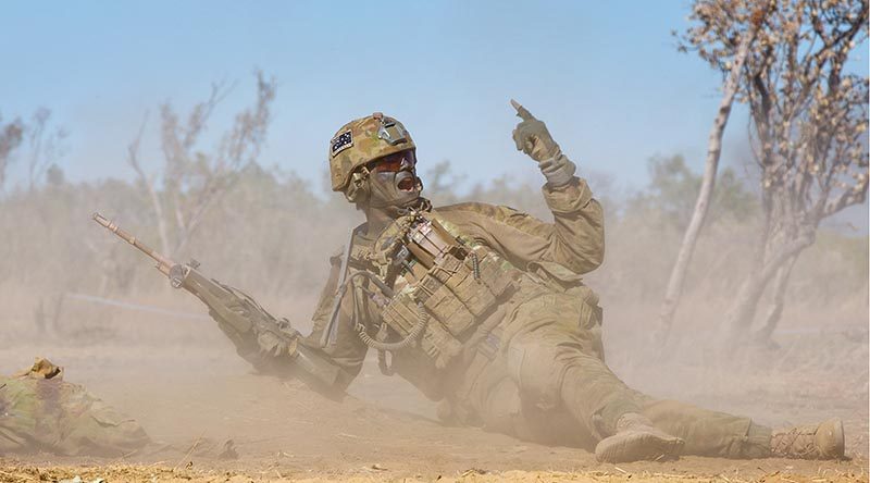 A 2RAR soldier orders his section to advance during a platoon attack, at Bradshaw Field Training Area, Northern Territory, during Exercise Talisman Sabre 2015. Photo by Lance Corporal Kyle Genner