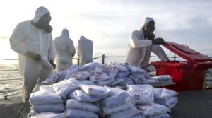 Members from HMAS Darwin prepare to destroy seized heroin after intercepting dhows off the coast of Africa. Photo by Able Seaman Sarah Ebsworth