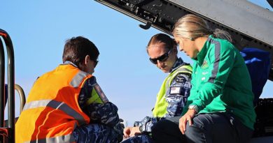 Leading Aircraftwoman Vanessa McNeil (left) and Leading Aircraftwoman Annie Tulloch show Katrina Gorry the cockpit of an F/A-18F Super Hornet during her visit to RAAF Base Amberley.