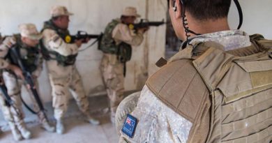 A New Zealand member of Task Group Taji, Training Task Unit supervises urban combat training for members of Iraq's 92nd Brigade at Taji Military Camp.