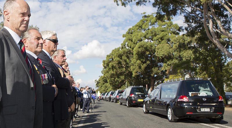 Hearses carrying the remains of 33 Australian service personnel and dependants leave RAAF Base Richmond after a repatriation ceremony at the base to welcome them home from cemeteries in Malaysia and Singapore. Photo by Corporal David Gibbs