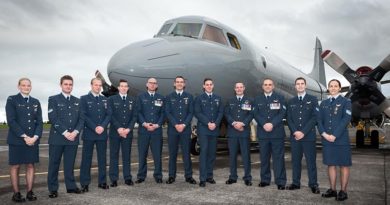 No. 5 Squadron 15/01 Orion Conversion Course graduates pose in front of the P-3K2 Orion on which they participated in a real-life search and rescue operation during their training.