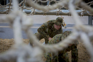 Australian Air Force Cadets Liam Cash tackles an obstacle during battle PT in the Canberra cold and rain at the Australian Defence Force Academy. *** Local Caption *** Australian Air Force Cadets (AAFC) from No 2 Wing commemorated the 75th anniversary of the AAFCs with a tour of military establishments and museums/memorials in Williamtown, Canberra and Sydney. The Australian Air Force Cadets (AAFC) is a youth oriented organisation that is administered and actively supported by the Royal Australian Air Force. The AAFC teaches you valuable life skills and will help you develop qualities including leadership, self reliance, confidence, teamwork and communication. Their fundamental aim is to foster qualities that will enable cadets to become responsible young adults, who will make a valuable contribution to the community. Please note the following distinction: Australian Air Force Cadets (AAFC), along with Australian Navy Cadets and Australian Army Cadets are members of the Australian Defence Force (ADF) Cadets. ADF Cadets are participants in the youth development program conducted by the three services in cooperation with the community but they are not members of the ADF. Officer Cadets (Air Force) and Staff Cadets (Army) are trainee officers undertaking instruction at the Australian Defence Force Academy or the Air Force Officers' Training School or Royal Military College Duntroon, The terms 'ADF Cadets', 'Officer Cadets' and 'Staff Cadets' are not interchangeable. Trainee naval officers are not cadets; they are commissioned officers with the rank of Midshipman.